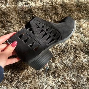 Black ankle boots with geometric detail